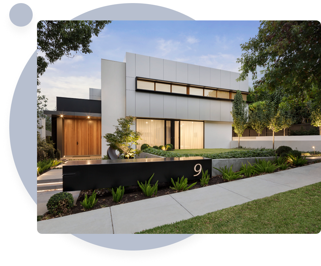 Modern house with a well-maintained lawn and inviting entrance.